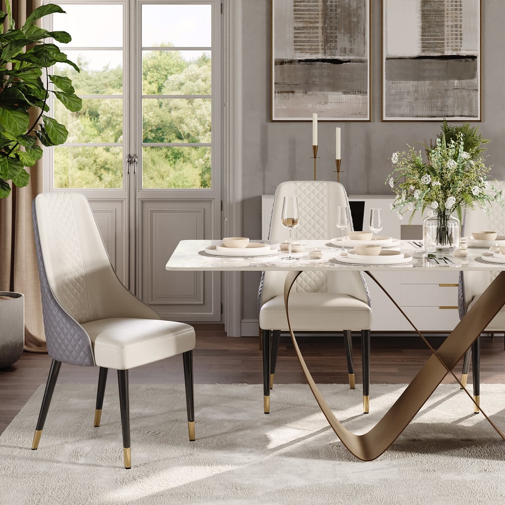 Close-up of white marble dining table edge with quilted dining chair detailing